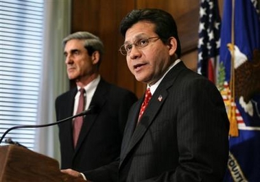 Attorney General Alberto Gonzales, joined by FBI Director Robert Mueller, left, discusses President Bush's decision to create a national security service within the FBI, during a press conference at the Justice Department in Washington, Wednesday, June 29, 2005. The new security arm will specialize in intelligence, part of a shake-up of the nation's disparate spy agencies, as recommended by a special White House commission. (AP 