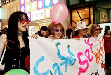 Female participants hold a banner during a parade at the 7th International Congress on AIDS in Asia and the Pacific in Kobe, Japan. To head off an expected explosion in HIV infections, Asia must focus on vulnerable groups such as sex workers, drug users and gay men by providing clean needles, condoms and education, experts said(AFP/