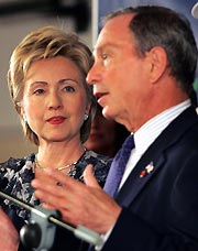 U.S. Senator and former first lady Hillary Clinton (L) looks on after joining New York Mayor Michael Bloomberg during a news conference in Singapore July 5, 2005. Hillary joined the New York team in their bid for the 2012 Olympic games, which will be decided by the International Olympic Committee in Singapore on July 6. [Reuters]