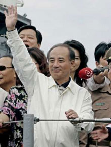 Taiwan's parliament speaker Wang Jin-pyng waves on the deck of a naval frigate off Suao, 100 km (62 miles) southwest of Taipei, June 21, 2005.