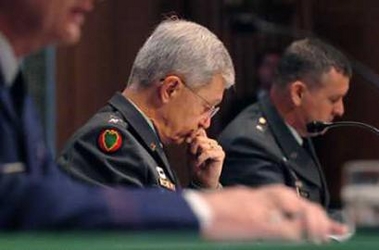 Army Gen. Bantz J. Craddock (C), commander of U.S. Southern Command, listens as investigators address a Senate Armed Services Committee hearing on possible abuse of detainees at Guantanamo Bay in Washington July 13, 2005. 