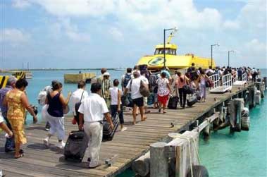 Tourists evacuate Isla Mujeres island on one of the last ferries as Hurricane Emily approaches Saturday July 16, 2005, in Islas Mujeres, Mexico. Mexican officials issued a hurricane warning Saturday for much of the eastern Yucatan peninsula, including the resort of Cancun, as Hurricane Emily barreled across the Caribbean south of Jamaica.(AP