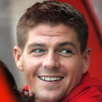 Liverpool's Steven Gerrard smiles from the bench during their UEFA Champions League first qualifying round, second leg soccer match against Total Network Solutions at the Racecourse ground, northern Wales, July 19, 2005.