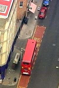 A grab from an aerial television picture shows a number 26 bus which was evacuated after London's transport system was hit by bombs, in east London, July 21, 2005. 