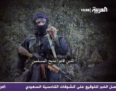 An insurgent in Afghanistan issues a warning in this image from TV broadcast by the Al Arabiya TV channel on Tuesday Aug. 9, 2005. The video, obtained last week by Al-Arabiya television, shows a multiethnic group of insurgents in Afghanistan including Europeans, Arabs and other nationalities preparing to attack U.S. troops . (AP