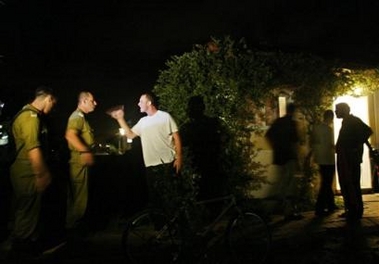 A settler refuses to let into his house a group of soldiers that came to appeal to him to leave of his own will, in the southern Gaza Strip settlement of Neve Dekalim, Tuesday, Aug. 16, 2005.