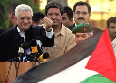 Palestinian leader Mahmoud Abbas gestures as he addresses a crowd during a celebration for Israel's Gaza withdrawal, at the Gaza international airport outside Rafah, in the southern Gaza Strip, Friday, Aug. 19, 2005.