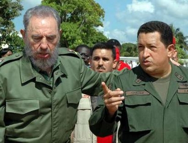 Venezuelan President Hugo Chavez (R) and his Cuban counterpart Fidel Castro arrive at Chavez's weekly broadcast, 'Alo Presidente,' in Sandino near Pinar del Rio, Cuba August 21, 2005. 