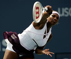 Serena Williams of the United States follows through on a return to Chan Yung-Jan of Taiwan at the U.S. Open tennis tournament in New York, August 29, 2005. 