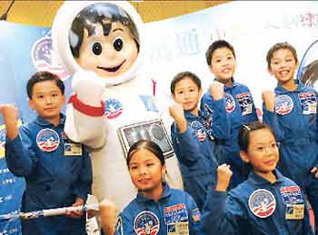 The six kids who took a "moonwalk" recently pose for photographers at a press conference in Hong Kong yesterday. The "junior astronauts" attended a three-day space training camp in Alabama, US, and won a space station design competition too.
