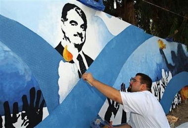 Lebanese artist Zaher Al-Bizri paints the portrait of slain former Lebanese Prime Minister Rafik Hariri on a 7 x 1.83 meters' (23 x 6 feet) painting, marking the 200th day since the Feb. 14 assassination of Hariri, in the southern city of Sidon, Lebanon, Wednesday, Aug. 31, 2005.