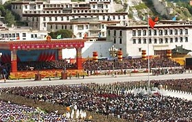 The national flag of China is hoisted at the celebration meeting place in Lhasa, capital of southwest China's Tibet Autonomous Region on Thursday, Sept. 1, 2005.