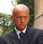 Italian referee Pierluigi Collina poses in front of Opel cars in a promotional photograph released by the auto maker August 29, 2005. The sudden resignation of referee Pierluigi Collina has left many Italians debating whether soccer's best-known match official was forced to quit.