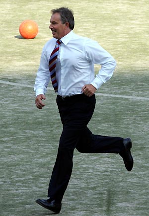 Britain's Prime Minister Tony Blair joins in a football training session at Yue Tan Stadium, Beijing, China, Tuesday Sept. 6, 2005. The Prime Minister is in China for two days for the EU/China Summit meeting.