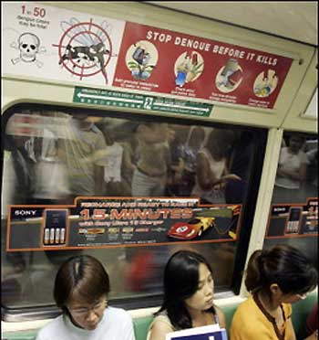 A subway train in Singapore carries a sign warning people about the dangers of dengue fever. 