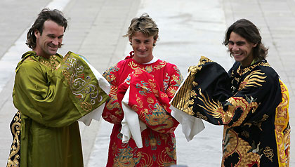 Spanish tennis players Carlos Moya (L-R), Juan Carlos Ferrero and Rafael Nadal, pose in Chinese royal attires at the Imperial Ancestral Temple in Beijing September 13, 2005. The China Open tennis tournament is on till September 25.