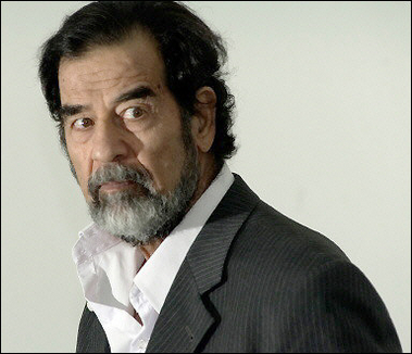 Saddam Hussein is questioned by chief investigative judge Raid Juhi (not in picture) in August 2005.