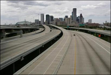 An empty highway of Houston is seen after thousands of residents evacuated the city in advance of Hurricane Rita September 23, 2005. Texas officials warned of a catastrophe and water spilled over levees to flood parts of New Orleans anew on Friday as Hurricane Rita barreled toward the U.S. Gulf Coast with winds reaching 135 mph (217 kph). [Reuters]