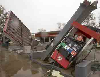 A gas station is damaged after Hurricane Rita pounded Nederland, Texas, September 24, 2005. [Reuters]