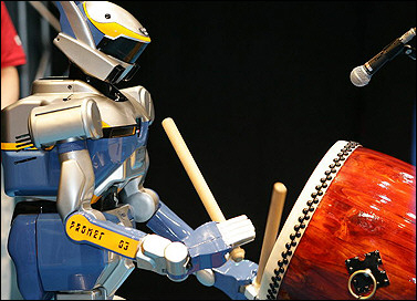 Humanoid robot HRP-2 plays a traditional Japanese drum with motions captured from a master drummer at the 2005 World Expo Aichi in Nagakute, Japan. 