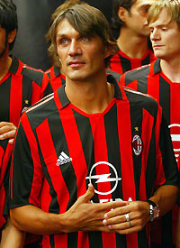 AC Milan captain Paolo Maldini stands with team mates after the unveiling of the new season's home jersey in New York July 29, 2005. 