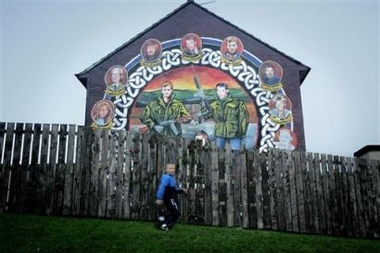 A Freshly painted Irish Republican Army mural in West Belfast, Northern Ireland, Sunday, September, 25, 2005. It has been reported Snday that the IRA have decommissioned all its weapons. (AP