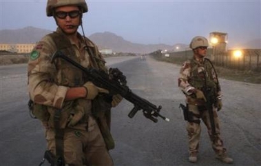 Norwegian soldiers close a road after a suicide attack in the outskirts of Kabul, Afghanistan, Wednesday Sept. 28, 2005.