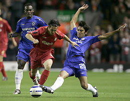 Liverpool's Louis Garcia (C) is tackled by Chelsea's Ferreira (R) during their Champions League Group G soccer match at Anfield, northern England, September 28, 2005.