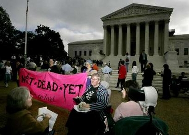 Disabled protesters against physician-assisted suicide gather in their wheelchairs,on the first day of the Gonzales v. Oregon case, outside the U.S. Supreme Court in Washington , October 5, 2005. 