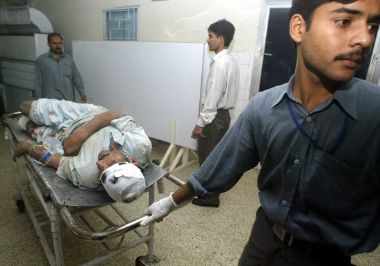 A Pakistani man injured when a building collapsed after an earthquake arrives in a hospital in Islamabad October 8, 2005.