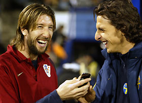 Injured Swedish soccer star Zlatan Ibrahimovic (R) and Croatia's substitute goalkeeper Joie Didulica laugh before their soccer match in a group eight World Cup 2006 soccer qualifying match between Croatia and Sweden in Zagreb October 8, 2005. 