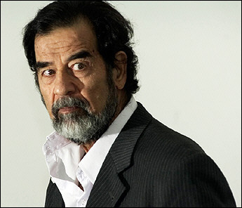 A photo released by the Iraqi Special Tribunal (IST) depicts Saddam Hussein during questioning in August 2005.