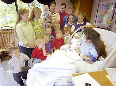 AP - Wed Oct 12, 1:13 PM ET In this photo released by the Discovery Health Channel shows the Duggar children and their father Jim Bob Duggar, top center, gather as their mother Michelle holds the 16th addition to the family Tuesday, Oct. 11, 2005, at St. Mary's Hospital in Rogers Ark. The girl Johannah was born Oct. 11, at the hospital. [AP]