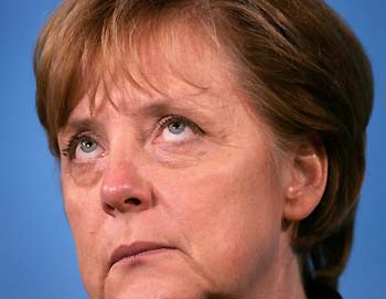 Conservative leader and Chancellor-designate Angela Merkel pauses as she addresses a news conference following the second round of coalition talks with the Social Democrats at her headquarters in Berlin October 24, 2005. The new German government will have to find 35 billion euros ($41.80 billion) in extra revenues and savings to meet European Union budget rules by 2007, political leaders said on Monday. It would be the biggest budget consolidation ever attempted by a postwar German government. "We are facing enormous challenges," Merkel said following talks on forming a power-sharing coalition with the Social Democrats (SPD). [Reuters]