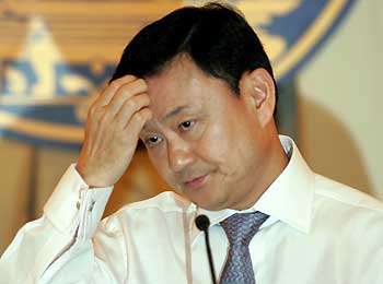 Thai Prime Minister Thaksin Shinawatra speaks during a weekly news conference at Government House in Bangkok October 27 2005. Thaksin said troops in the south would become more pro-active in their operations after five villagers and two militants were killed overnight in Muslim southern Thailand when insurgents launched about 50 raids on remote villages in the restive region.