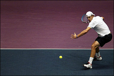 US Andy Roddick returns a forehand to French Fabrice Santoro, during the Lyon Tennis Grand Prix' semi final in Lyon, central eastern France. Roddick won 6-4, 7-5.(AFP/Martin Bureau