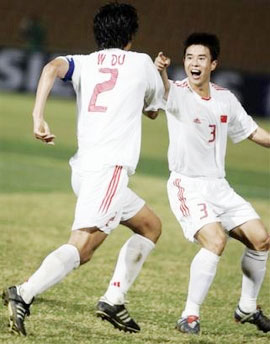 China's Sun Xiang (3) points to Du Wei who scored the second goal against Japan during the second half of a semifinal soccer match at the 4th East Asian Games held in Macau, China, Saturday, Nov. 5, 2005. China defeated Japan 2-1 and will face North Korea in the final. (AP 