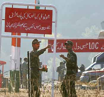 Indian solders prepare for the opening of the checkpoint of the Line of Control (LoC) between India's Poonch and Titrinote, Pakistan-administered Kashmir, about 180-km (111.8 miles) east of Islamabad, November 7, 2005.