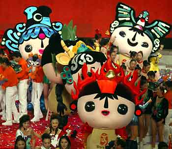 Huge inflated cartoon figures of the five Beijing Olympic mascots walk on stage at the Workers' Stadium during a gala show on Friday evening.