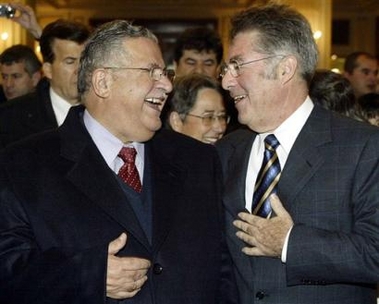 Austrian President Heinz Fischer, right, and his counterpart from Iraq Jalal Talabani share a laugh, on Sunday, Nov. 13, 2005, at a hotel in Vienna.
