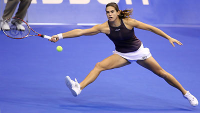 Mauresmo of France lunges to hit a forehand to compatriot Mary Pierce during the final of the WTA Tour Championships in Los Angeles November 13, 2005.