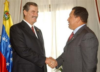 In this photo provided by Miraflores Prensa, Mexican President Vicente Fox, left, shakes hands with Venezuelan President Hugo Chavez in Rio de Janeiro, Brazil, Thursday, Nov. 4, 2004, at the 19-nation Group of Rio summit. 