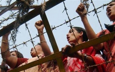 Bangladesh opposition Awami League activists shout before a police barricade in Dhaka, Bangladesh, Thursday, Nov. 24, 2005.