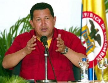 Venezuelan President Hugo Chavez talks at a news conference after signing mutual agreements with Colombian President Uribe Velez in Falcon state, to the west of Caracas, November 24, 2005.