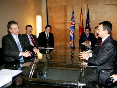 British Prime Minister Tony Blair (L) gestures to Spanish Prime Minister Jose Luis Rodriguez Zapatero (R) during a bilateral meeting at the Euro-Mediterranean summit in central Barcelona November 27, 2005. Leaders of 35 European and Mediterranean countries began a two-day summit in Barcelona on Sunday. 