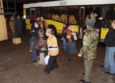 Chechen refugees are seen in Makhachkala airport in the southern Russian province of Dagestan, Tuesday, Dec. 6, 2005, while returning back to Chechnya.