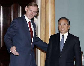 U.S. Deputy Secretary of State Robert Zoellick (L) gestures alongside China's Vice Foreign Minister Dai Bingguo before their session of the U.S.-China Senior Dialogue at the State Department in Washington December 7, 2005. 