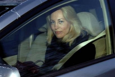 Valerie Plame pulls out of her driveway on her way to work on Friday, Dec. 9, 2005 in Washington.