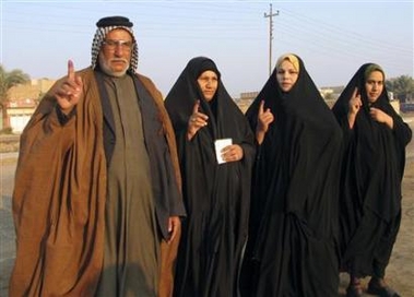 Iraqi residents show their stained fingers after voting during Iraq's historical parliamentary elections in the Iraqi city of Diwaniya, 180km (112 miles) south of Baghdad, December 15, 2005. 