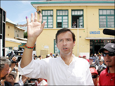 Bolivian presidential hopeful Jorge Quiroga waves after voting at Bolivia's general elections, in La Paz.